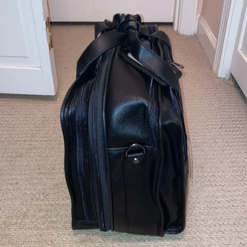 NWT black leather expandable multiple pockets with shoulder strap